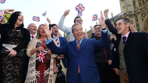 <p>UKIP leader Nigel Farage greets supporters in Westminster after Britain voted to leave the European Union in June 2016</p>