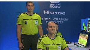 <p>Shaun Evans (left) makes the controversial hand gesture while being introduced as a video assistant referee before Germany versus Curaçao. Photograph: Youtube </p> <p>Shaun Evans (left) makes the controversial hand gesture while being introduced as a video assistant referee before Germany versus Curaçao. Photograph: Youtube </p>