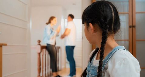 Stressed and unhappy young girl hide from domestic violence at home. Synchronos
