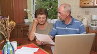 Senior couple going over bills