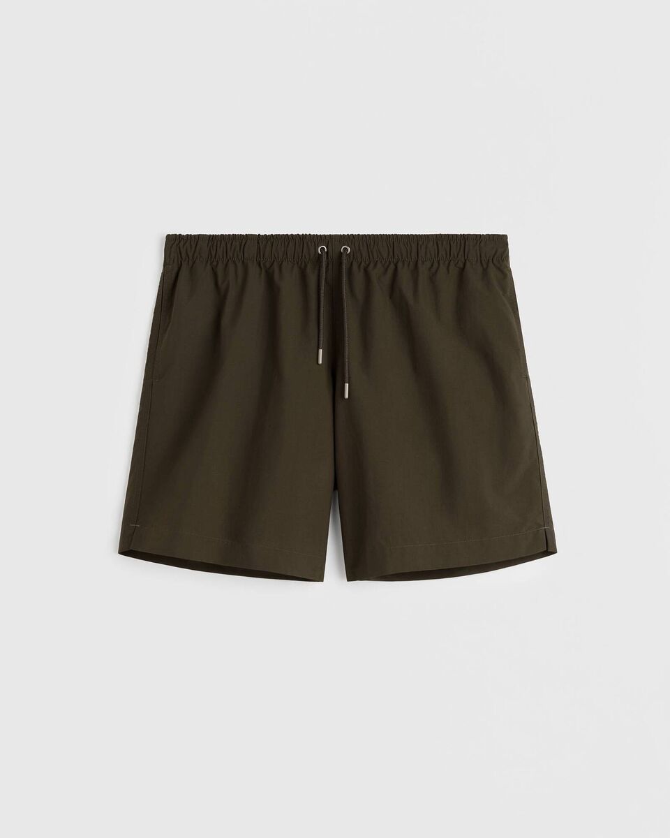 Olive Green Swim Shorts, €180, Tekla. Olive Green Swim Shorts, €180, Tekla.