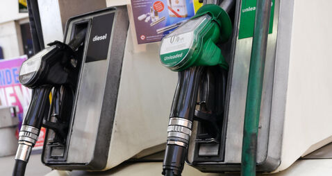 unleaded petrol and diesel fuel pumps at a self service petrol station in the UK