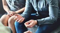 Couple counseling or therapy session. Man talking about problems in the family. Husband and wife meeting their psychiatrist.