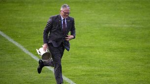 <p>Uachtarán Chumann Lúthchleas Gael Jarlath Burns, holding the Liam MacCarthy Cup, runs for cover during a sudden rain shower. Pic: Ray McManus/Sportsfile</p> <p>Uachtarán Chumann Lúthchleas Gael Jarlath Burns, holding the Liam MacCarthy Cup, runs for cover during a sudden rain shower. Pic: Ray McManus/Sportsfile</p>