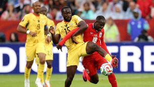 <p>Cecilio Waterman and Elisha Owusu compete for the ball. Picture: Darrian Traynor/Getty</p>