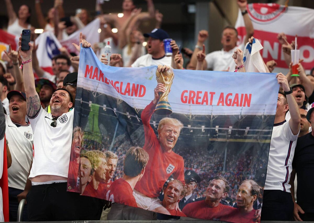 MAKE ENGLAND GREAT AGAIN: England fans hold up a banner in the likeness of Donald Trump at Dallas Stadium. Picture: Michael Steele/Getty MAKE ENGLAND GREAT AGAIN: England fans hold up a banner in the likeness of Donald Trump at Dallas Stadium. Picture: Michael Steele/Getty