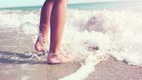 Jumping in the sea waves on the beach
