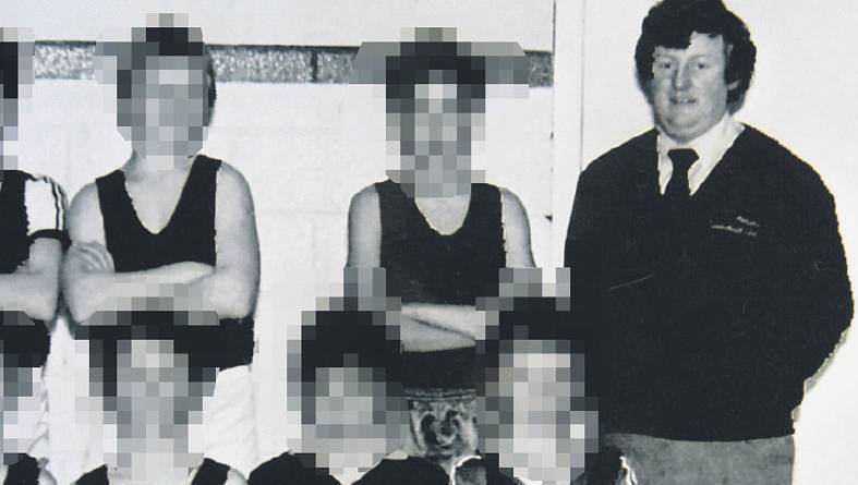 Bill Kenneally with a young basketball team in 1984