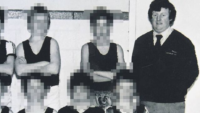 <p>Bill Kenneally with a young basketball team in 1984</p>