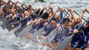 Competitors take part in the Aberdeen Dragon Boat Race (Chan Long Hei/AP)