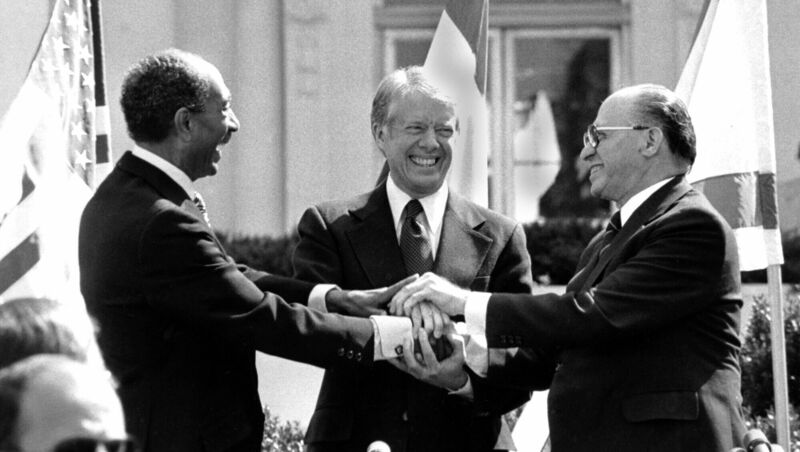 Then Egyptian president Anwar Sadat, former US president Jimmy Carter, and then Israeli prime minister Menachem Begin clasp hands on the north lawn of the White House after signing the peace treaty between Egypt and Israel on March 26, 1979. File Picture: AP Then Egyptian president Anwar Sadat, former US president Jimmy Carter, and then Israeli prime minister Menachem Begin clasp hands on the north lawn of the White House after signing the peace treaty between Egypt and Israel on March 26, 1979. File Picture: AP