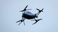 A Manna delivery drone flies over the ground during the match 3/5/2026
