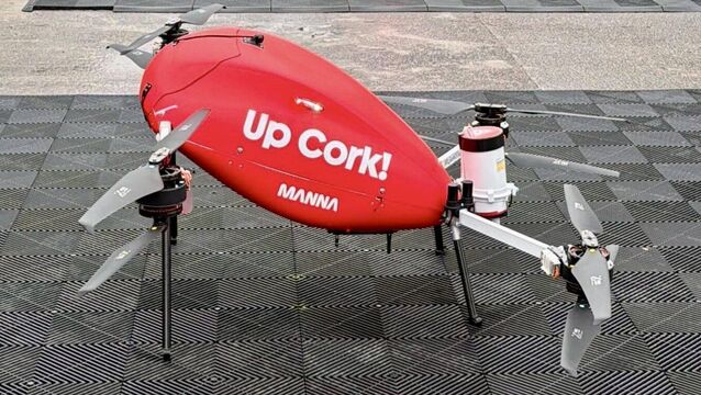 <p>Manna delivery drone in the red colour of Cork with the message Up Cork! printed on the side. Picture: Larry Cummins</p>