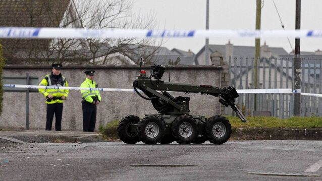 <p>A 2015 file photo of gardaí supervising the removal of a suspect device by the Defence Force’s Explosive Ordnance Disposal unit. The device found in Bandon on Thursday was found at the home of a man who develops accommodation for asylum seekers. File picture: Jim Coughlan</p>