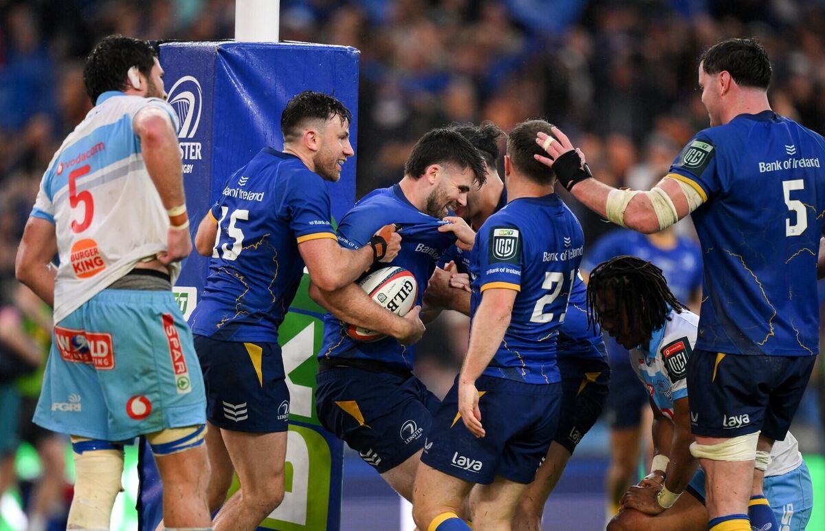 Harry Byrne of Leinster, centre, celebrates with teammates, including Hugo Keenan, left, after scoring their side's fifth try. Pic: Brendan Moran/Sportsfile Harry Byrne of Leinster, centre, celebrates with teammates, including Hugo Keenan, left, after scoring their side's fifth try. Pic: Brendan Moran/Sportsfile