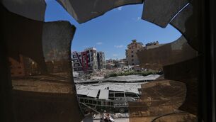 Buildings damaged by Israeli strikes seen through shattered glass from the Jabal Amel Hospital in the southern port city of Tyre, Lebanon (Hassan Ammar/AP) Buildings damaged by Israeli strikes seen through shattered glass from the Jabal Amel Hospital in the southern port city of Tyre, Lebanon (Hassan Ammar/AP)
