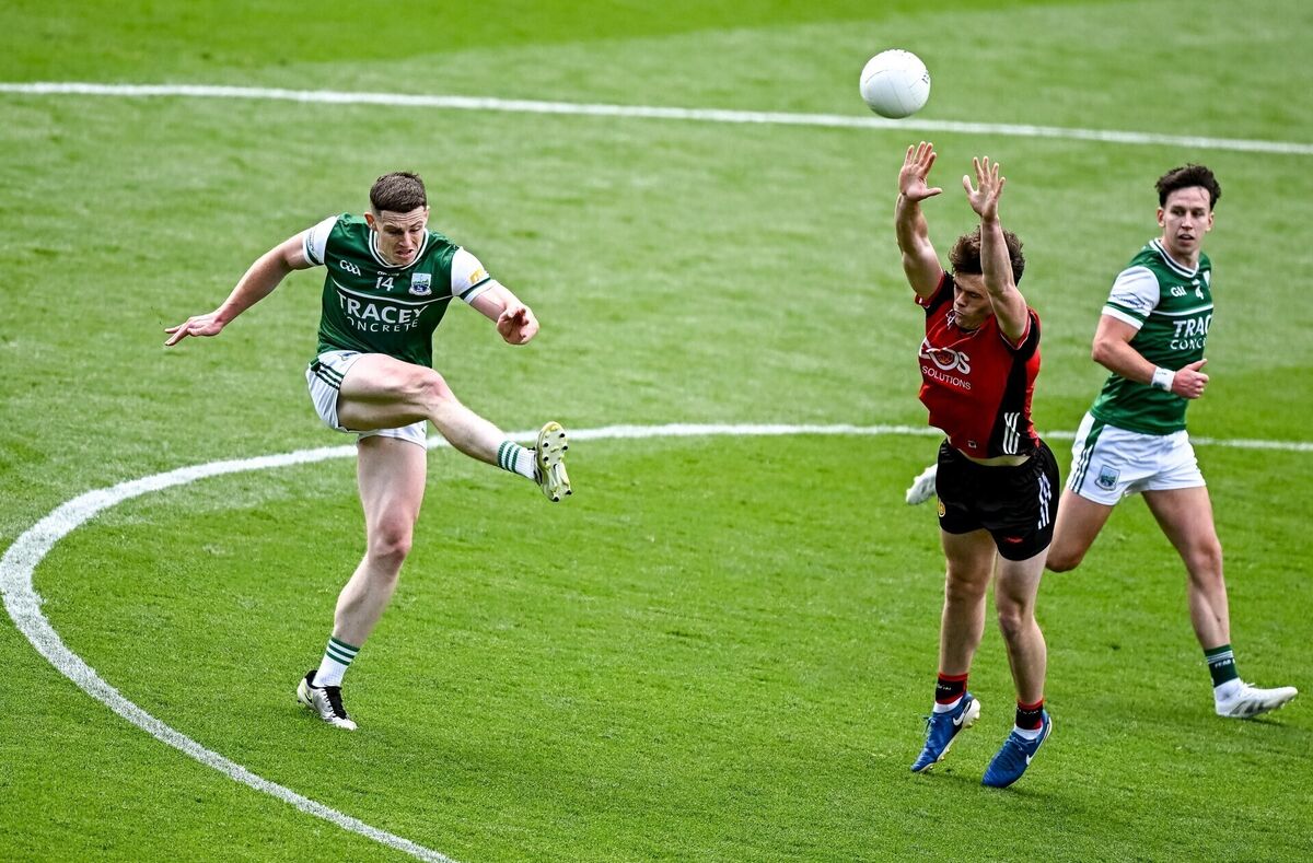 Darragh McGurn of Fermanagh kicks a point, under pressure from Shane Annett of Down. Picture: Seb Daly/Sportsfile Darragh McGurn of Fermanagh kicks a point, under pressure from Shane Annett of Down. Picture: Seb Daly/Sportsfile