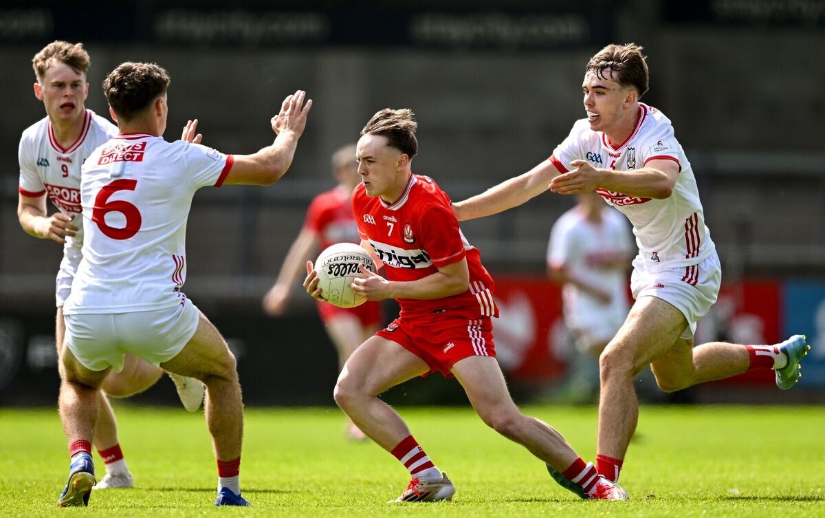 Lorcan Higgins of Derry in action against Conor Downing, left and Darragh O'Sullivan of Cork. Pic: Sam Barnes/Sportsfile