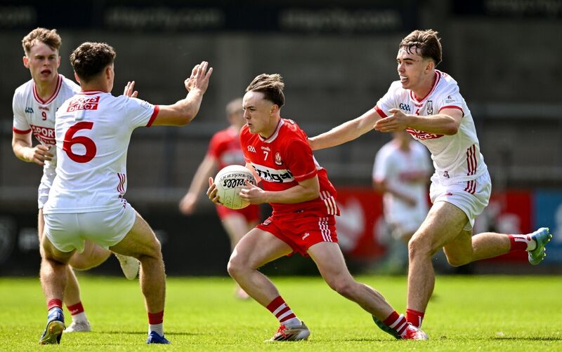 Lorcan Higgins of Derry in action against Conor Downing, left and Darragh O'Sullivan of Cork. Pic: Sam Barnes/Sportsfile Lorcan Higgins of Derry in action against Conor Downing, left and Darragh O'Sullivan of Cork. Pic: Sam Barnes/Sportsfile