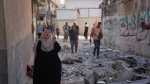 <p>Residents in Gaza City (Abdel Kareem Hana/AP)</p>