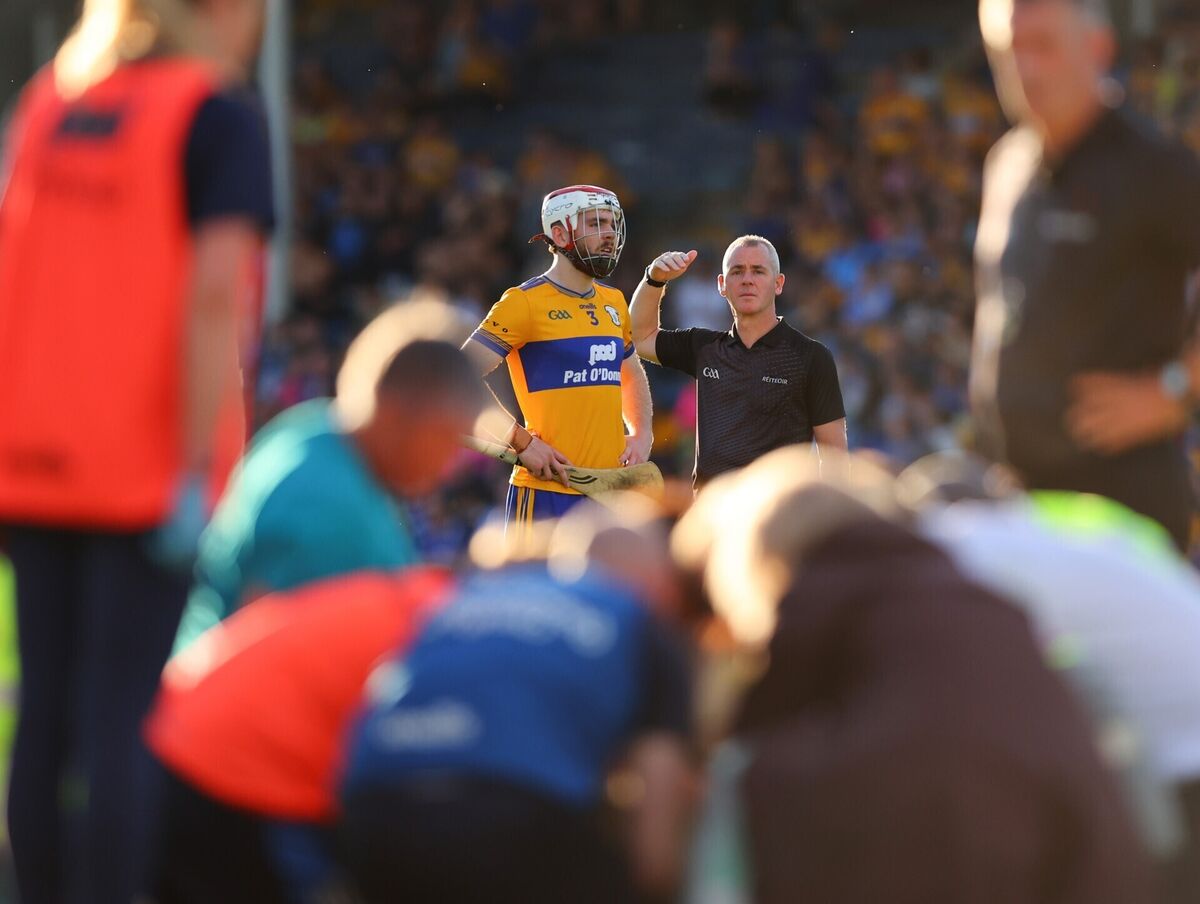 Clare's Conor Leen with referee James Owens as David Reidy receives medical treatment for a serious head injury. Picture: Tom O'Hanlon/Inpho Clare's Conor Leen with referee James Owens as David Reidy receives medical treatment for a serious head injury. Picture: Tom O'Hanlon/Inpho