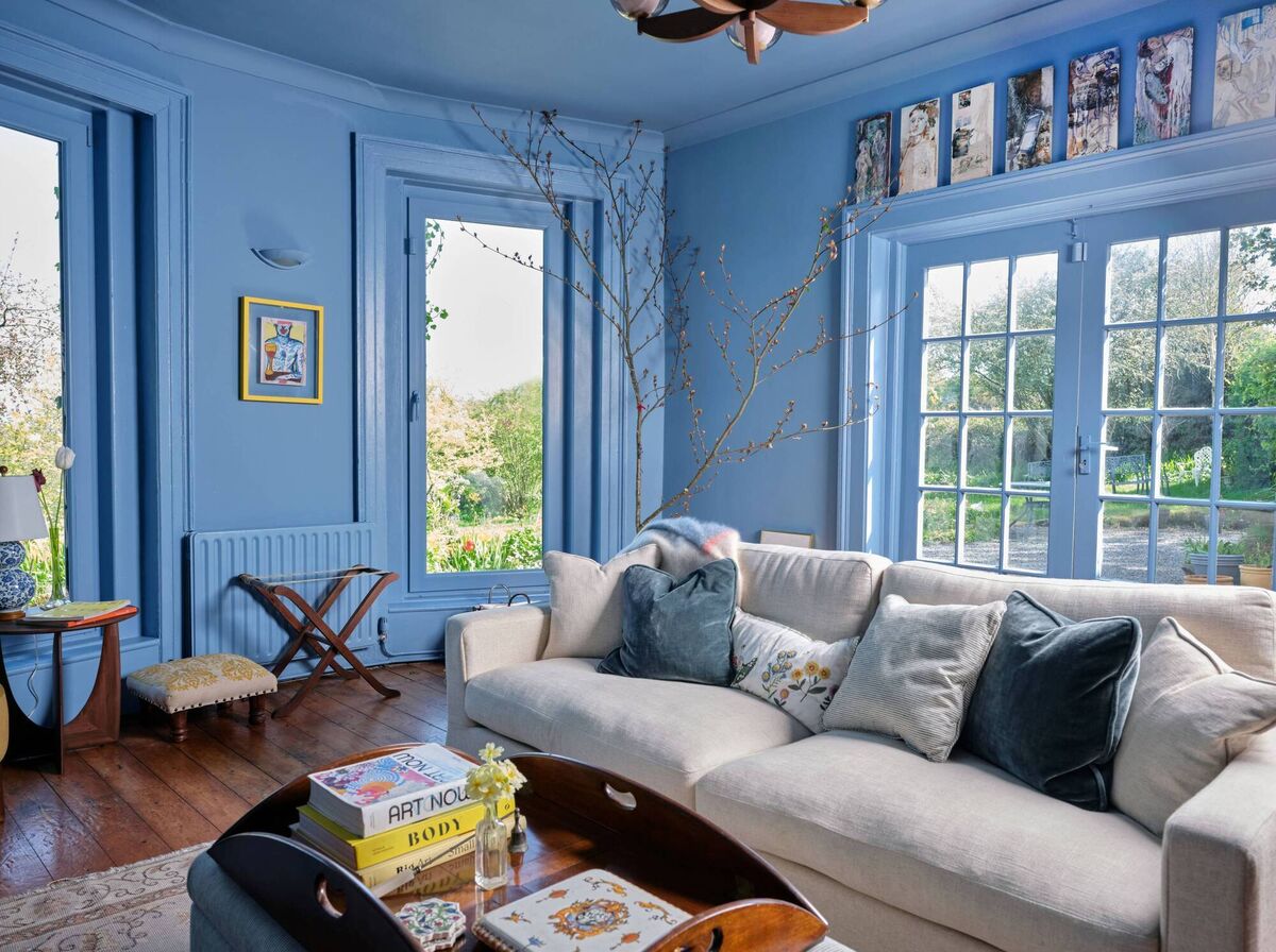 Boathouse Blue is the colour drenched across walls, ceilings and windows