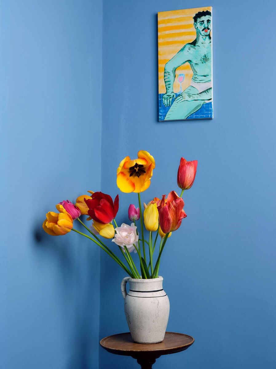 Flowers from the garden pop against the Boathouse Blue from Dulux Heritage