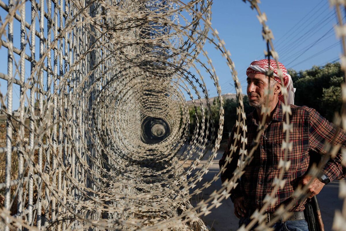 A Palestinian farmer stands near an Israeli-erected fence in Israeli occupied Palestinian West Bank: Ireland's EU presidency programme cites the 'key priority' of resolving the Israel-Palestine conflict. Picture: Zain Jaafar / AFP via Getty Images A Palestinian farmer stands near an Israeli-erected fence in Israeli occupied Palestinian West Bank: Ireland's EU presidency programme cites the 'key priority' of resolving the Israel-Palestine conflict. Picture: Zain Jaafar / AFP via Getty Images