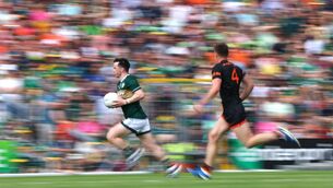 <p>MOTORING: Kerry's Paul Murphy flies up the open terrace side of Fitzgerald Stadium with Armagh's Gareth Murphy in hot pursuit during Saturday's All-Ireland SFC Rd 3 clash. Pic: James Crombie, Inpho</p>
