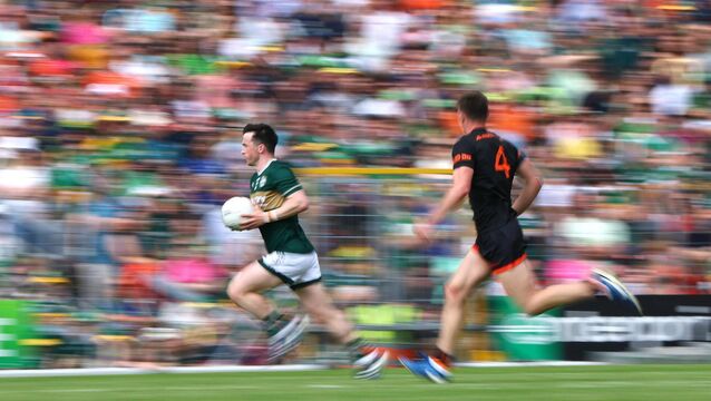 <p>MOTORING: Kerry's Paul Murphy flies up the open terrace side of Fitzgerald Stadium with Armagh's Gareth Murphy in hot pursuit during Saturday's All-Ireland SFC Rd 3 clash. Pic: James Crombie, Inpho</p>