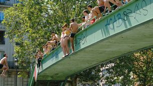 <p>Young people jump into the Saint-Martin Canal during a heatwave in Paris. Picture: Vincent Koebel/Nur/Getty </p> <p>Young people jump into the Saint-Martin Canal during a heatwave in Paris. Picture: Vincent Koebel/Nur/Getty </p>