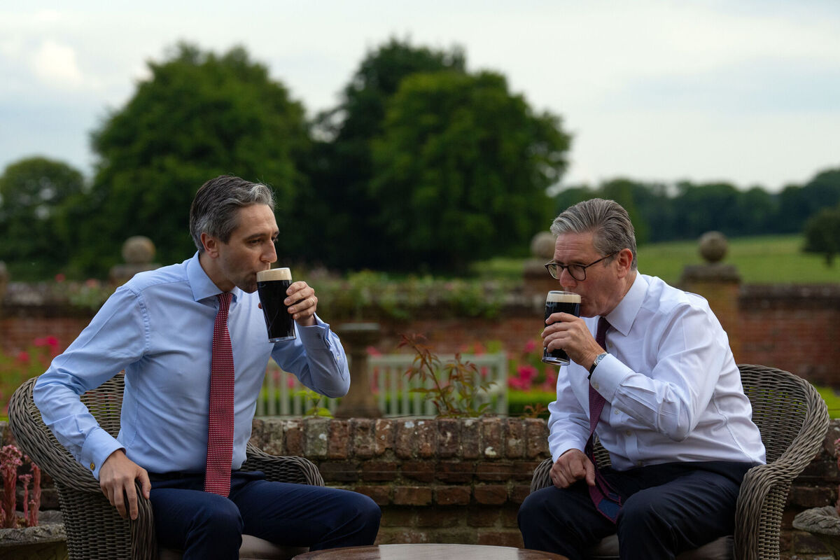 Then taoiseach Simon Harris and British prime minister Keir Starmer taking part in a photo-opportunity drinking pints of Guinness during Mr Harris's visit in July 2024. Picture: Carl Court/PA Then taoiseach Simon Harris and British prime minister Keir Starmer taking part in a photo-opportunity drinking pints of Guinness during Mr Harris's visit in July 2024. Picture: Carl Court/PA