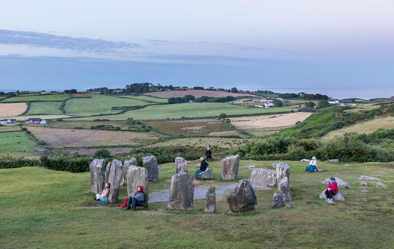 Visitors wait to welcome the summer solstice at Drombeg Stone Circle outside Glandore, Co. Cork.  Picture: David Creedon