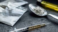drug syringe and cooked heroin on spoon. drug addict problem and therapy concept