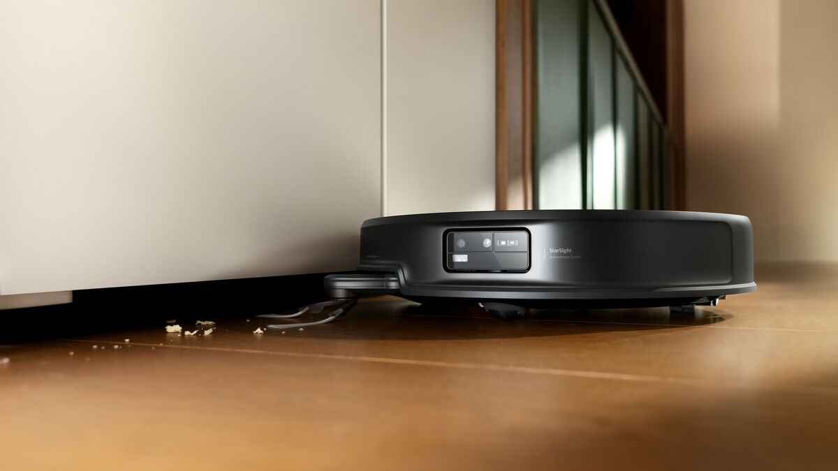 The slim-profile Roborock Saros 20 glides effortlessly under low-clearance furniture to reach hidden dust. Picture: RoboRock