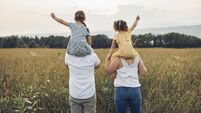 Happy family mother father and children daughter on nature sunset