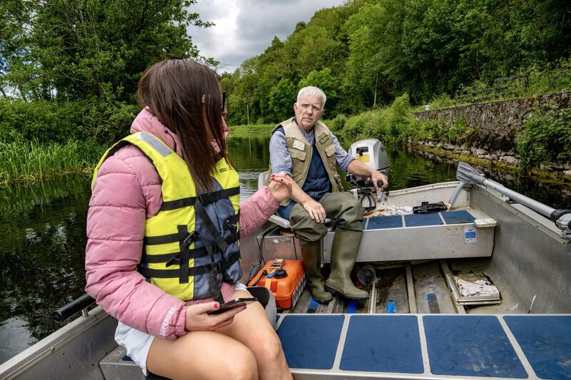 Jim Harding chats with 'Irish Examiner' reporter Sarah Horgan aboard his boat on the River Barrow. Picture: Chani Anderson