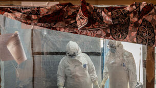 Health workers tend to an Ebola patient at the Rwampara Treatment Center in Ituri, Democratic Republic of the Congo (Moses Sawasawa/AP) Health workers tend to an Ebola patient at the Rwampara Treatment Center in Ituri, Democratic Republic of the Congo (Moses Sawasawa/AP)