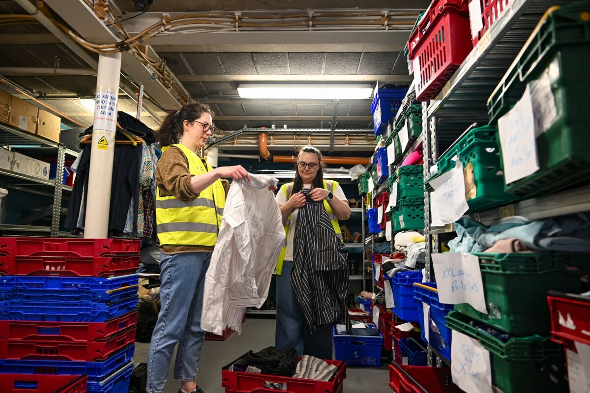 Volunteers sort donated clothing at The Lighthouse Café.