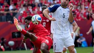 <p>Bosnia's Sead Kolasinac deflects the ball with his forearm on a shot from Canada's Jonathan David. Pic: Frank Gunn/The Canadian Press via AP.</p>
