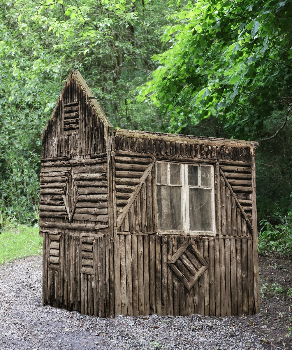 The rustic timber summerhouse.