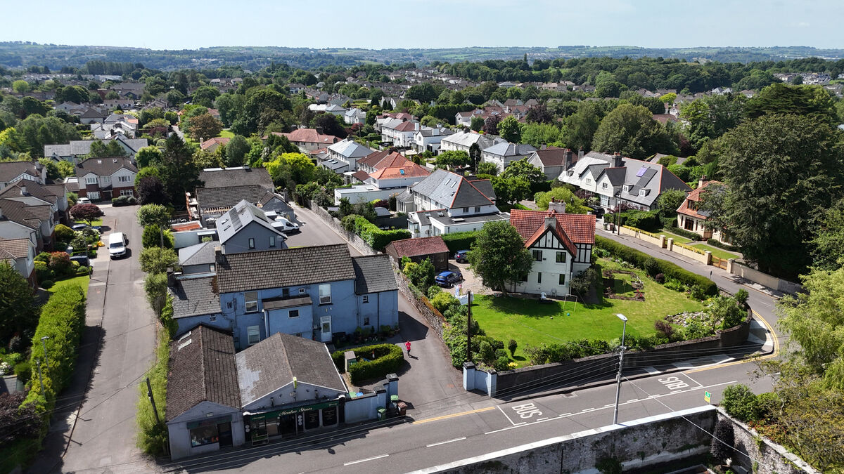 The entrance to Menloe Gardens is visible to the right of the picture, with Menloe Stores in the foreground. Picture: Larry Cummins
