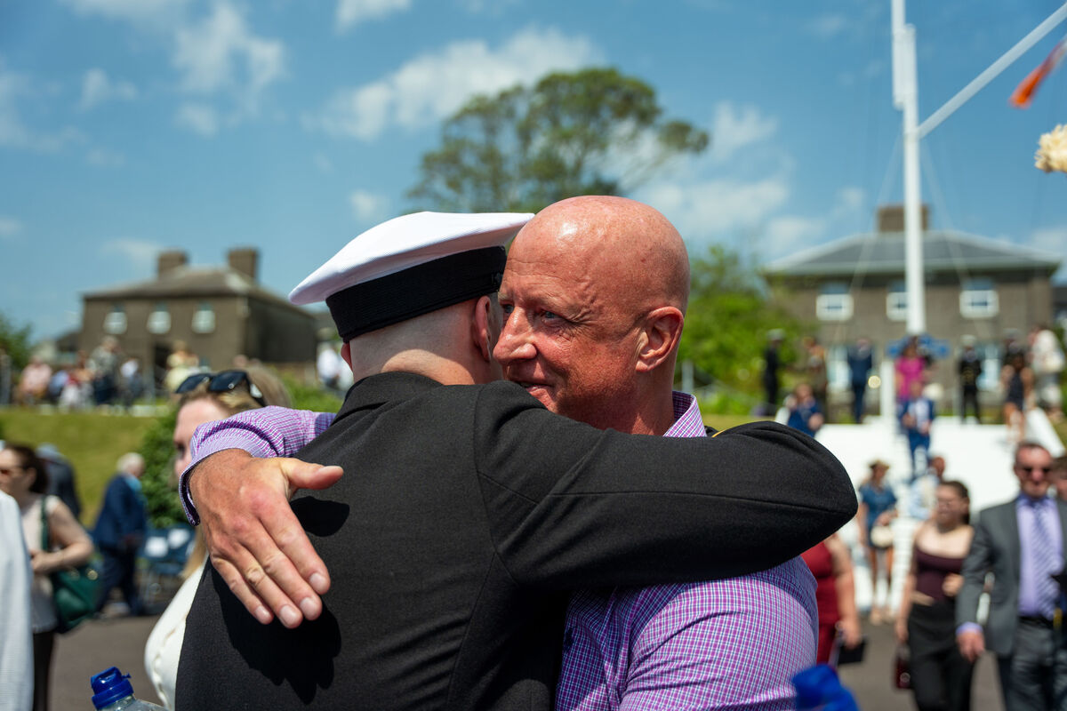 Naval graduate Ensign Jack McDonough-Elwood is hugged by his father Graham Elwood at the commissioning ceremony of new officers at Haulbowline. Picture: Noel Sweeney Naval graduate Ensign Jack McDonough-Elwood is hugged by his father Graham Elwood at the commissioning ceremony of new officers at Haulbowline. Picture: Noel Sweeney