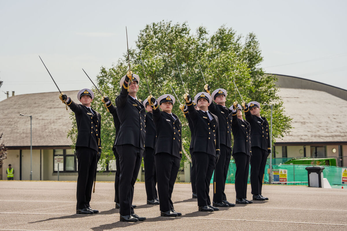 Newly commissioned naval officers raise their swords during the commissioning ceremony at the naval base on Haulbowline Island on Thursday. Picture: Noel Sweeney Newly commissioned naval officers raise their swords during the commissioning ceremony at the naval base on Haulbowline Island on Thursday. Picture: Noel Sweeney