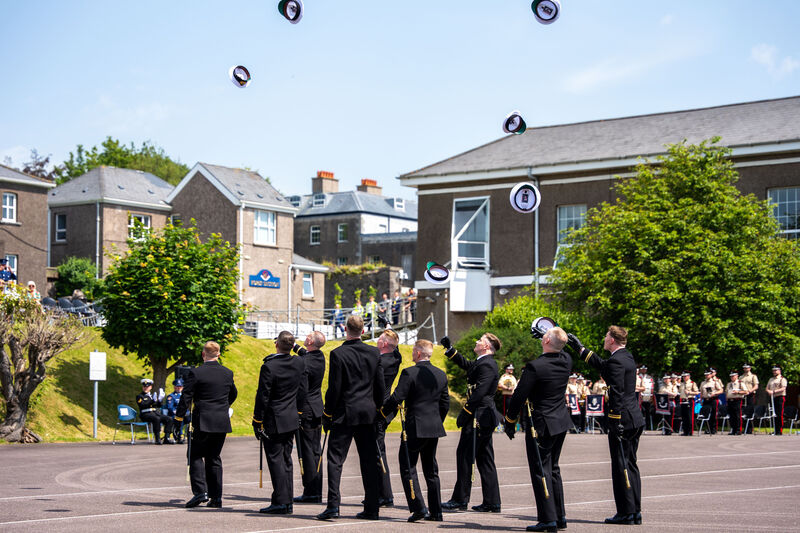 Naval graduates throw their hats in the air at the naval graduation ceremony. Picture: Noel Sweeney