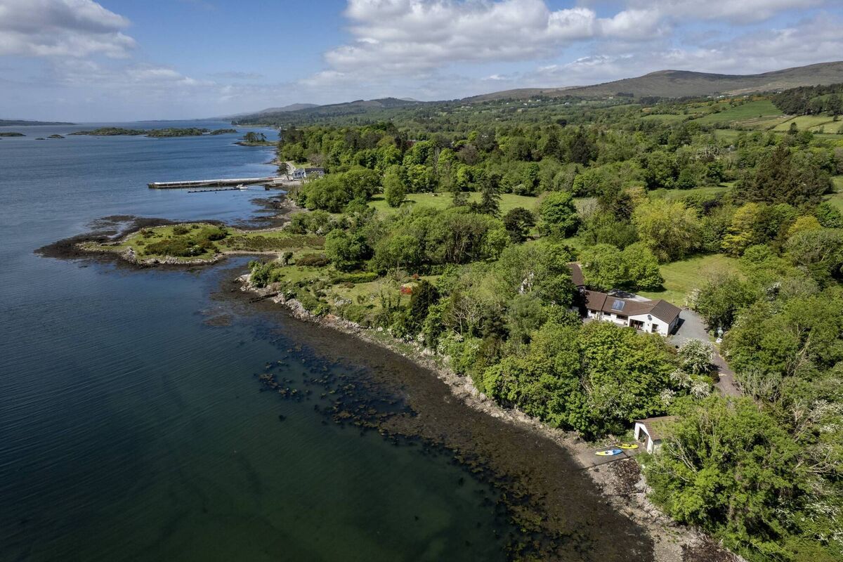 Coastline at Lower Reen with house hidden in the trees