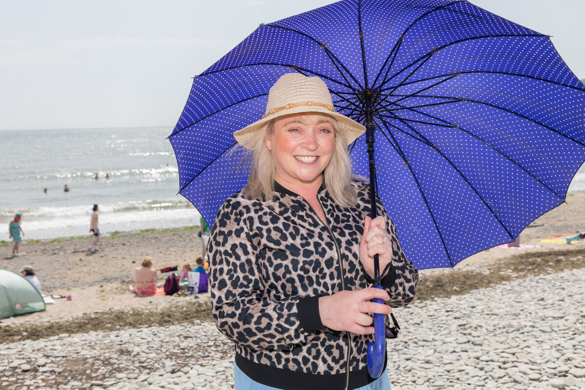 Elizabeth McGeough from Mallow was staying in the shade on one of the hottest days of the year in Fountainstown, Co Cork. Picture: David Creedon