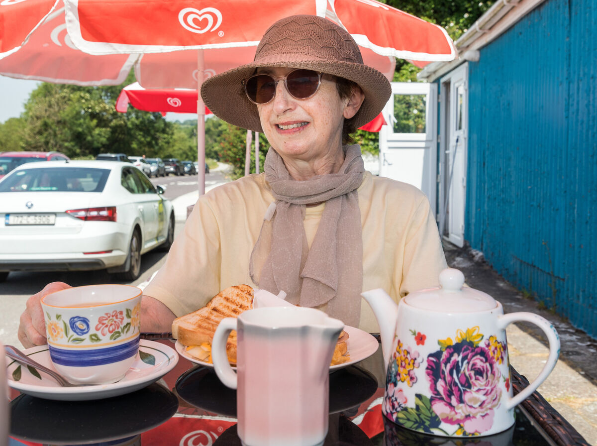 Eileen Murphy from Douglas enjoying afternoon tea under a parasol at Angela's Shop in Fountainstown, Co Cork. Picture: David Creedon