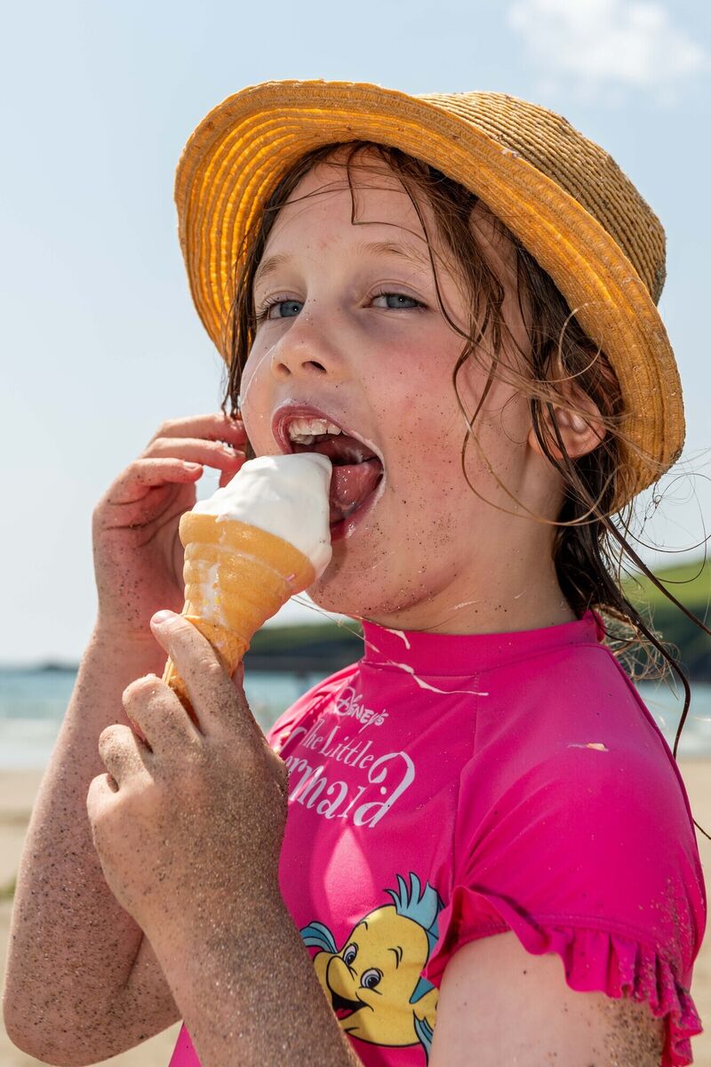 Danielle Jordan from Tipperary enjoying an ice cream cone on the Warren Beach in Rosscarbery, West Cork. Picture: Andy Gibson.
