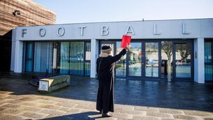 <p>POLITICAL FOOTBALL: A protester at FAI Headquarters. Pic: INPHO/Tom Maher</p>